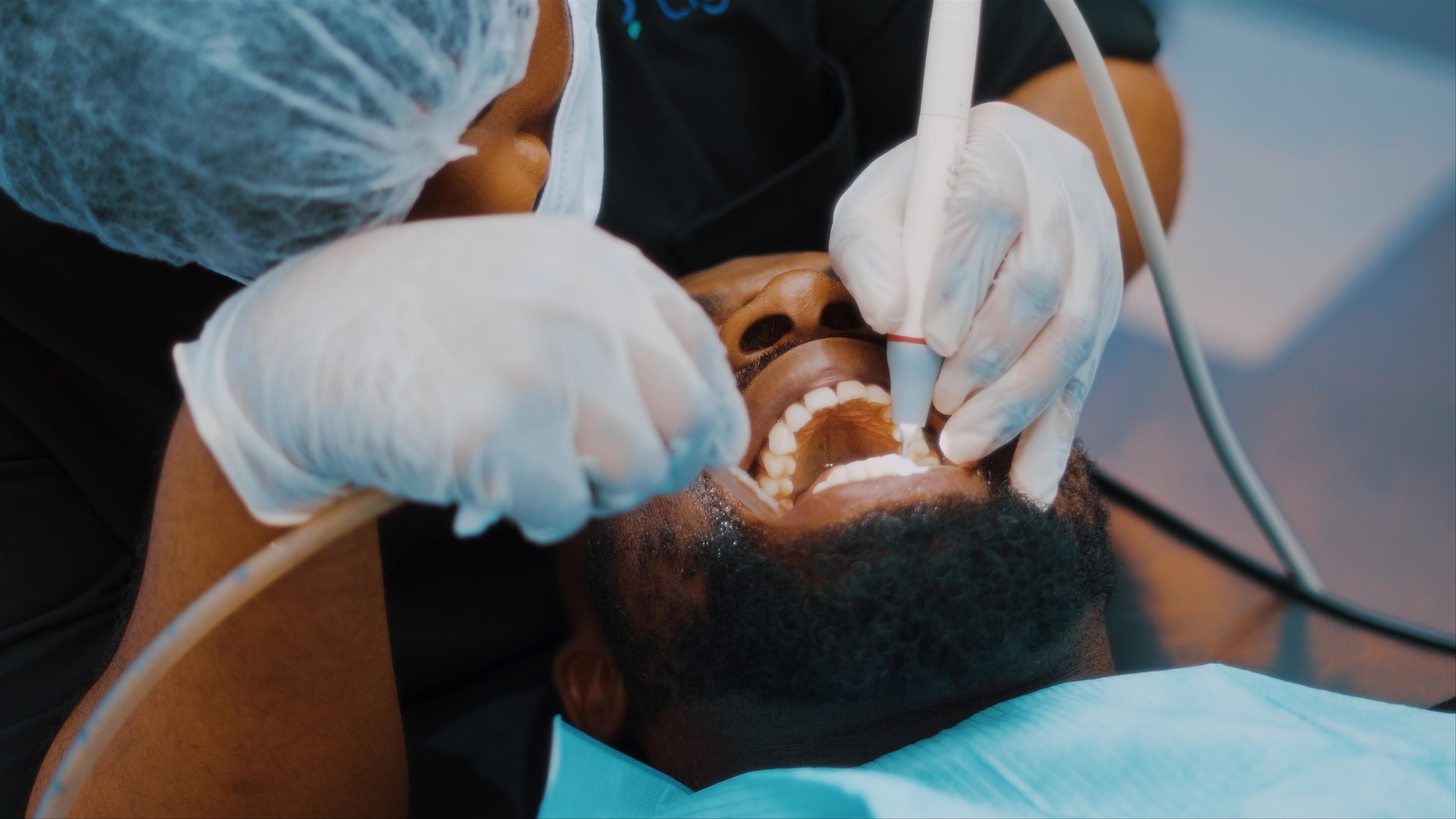 Dentist performing bone grafting procedure