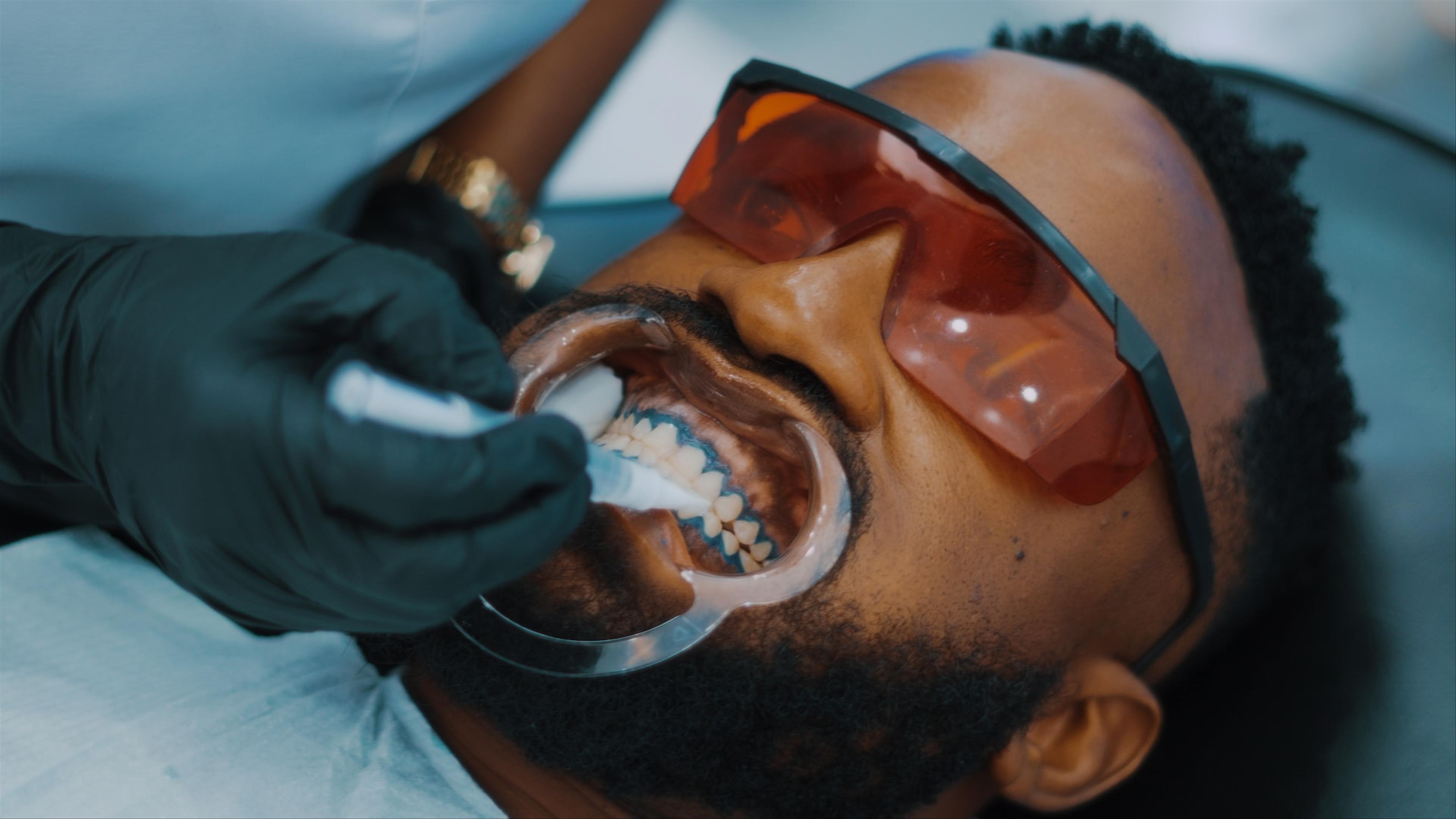 Dentist performing gum grafting procedure