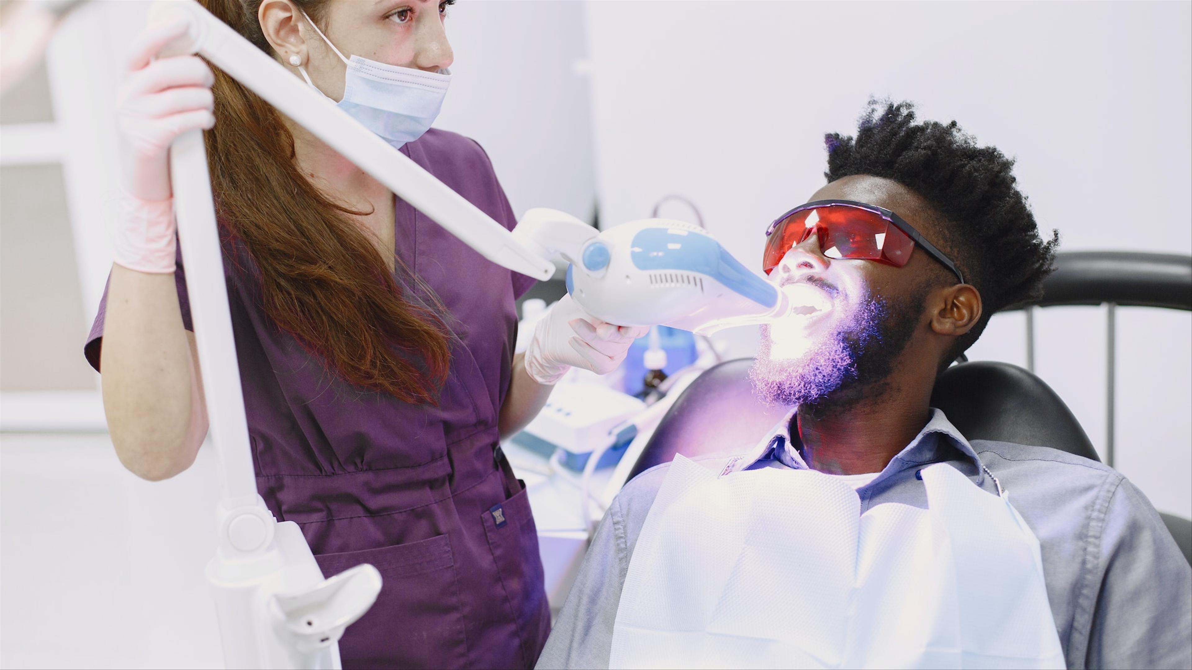 Patient showing off a bright smile after tooth whitening